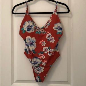Orange floral one piece swimsuit.
